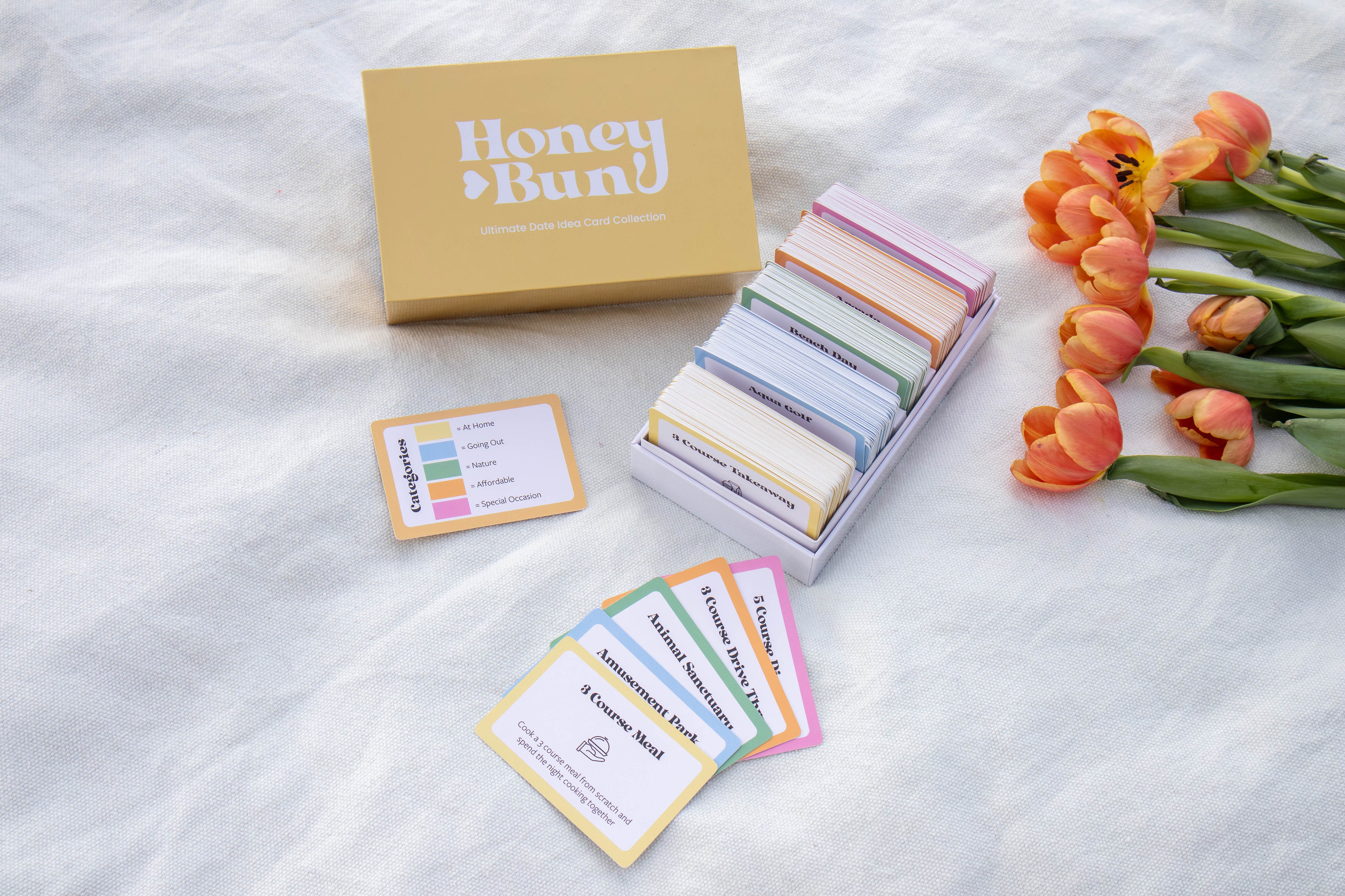 Set of 250 date idea cards that are colour coded for 5 different categories, at home date ideas, going out date ideas, nature date ideas, affordable date ideas, special occasion date ideas, date ideas card box, date night in a box
