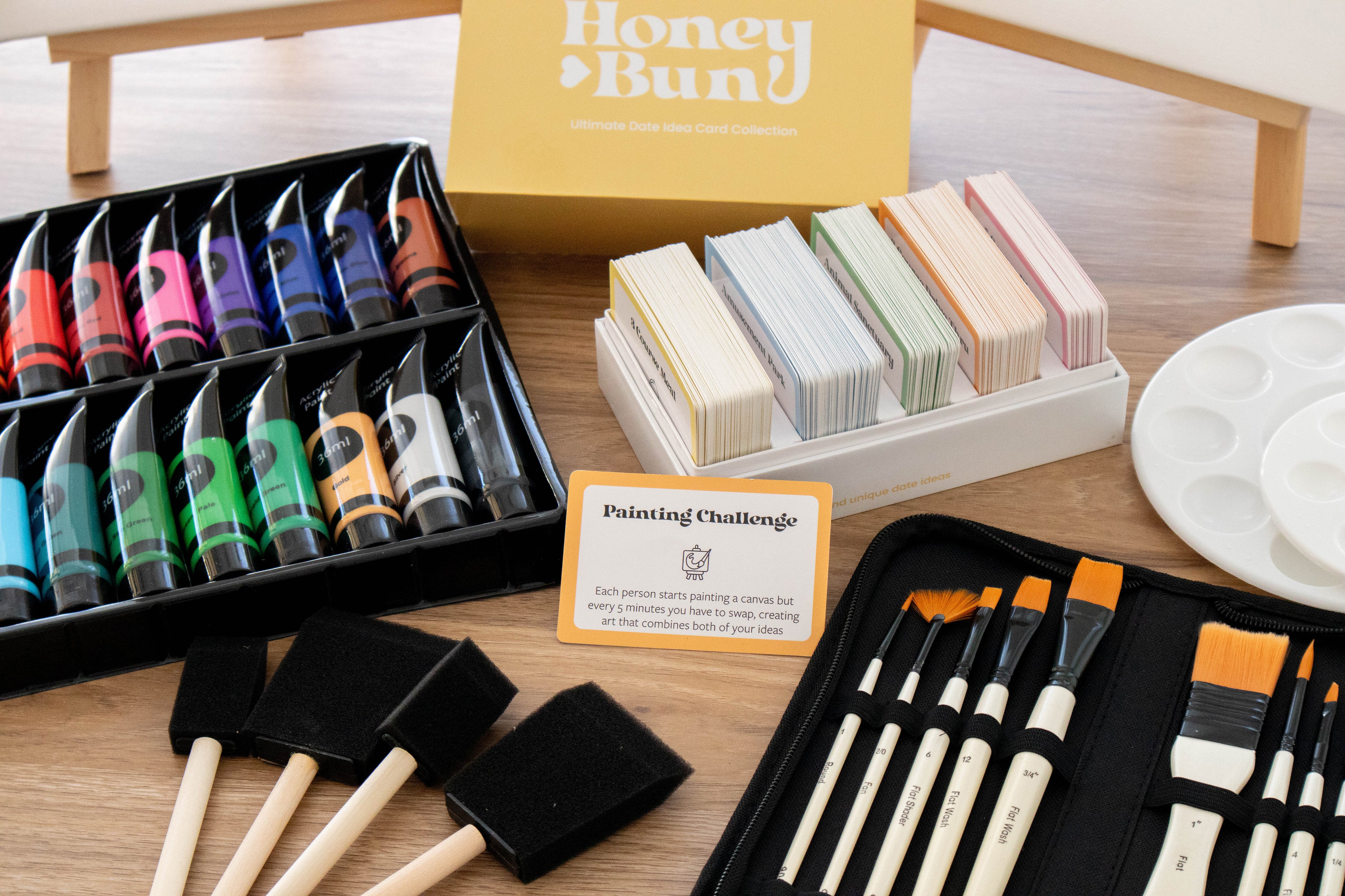Example of a fun and creative date night idea, showing an affordable at home date idea, date idea cards, painting challenge date, wholesome painting date for couples, at home couples activities